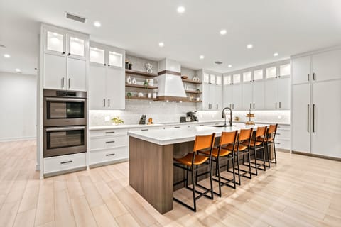 The kitchen, a chef's delight with kitchen island and breakfast bar.