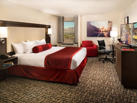 Stretch out on the plush king bed with city views.
