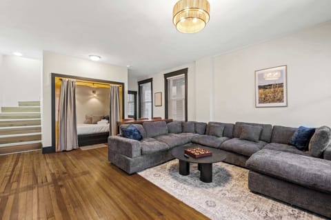 Living Room: Relax in our bright living space, featuring a comfy sofa, wooden floors, and plenty of natural light to make you feel right at home.