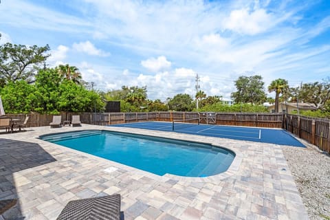 heated pool with  stunning pavered pool deck awaits!