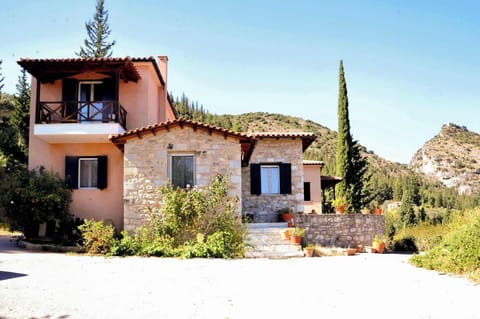 Facade of the Property – Traditional architecture in a scenic natural setting.