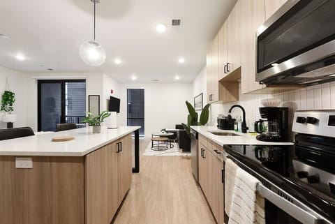 Kitchen + Island.  FULLY stocked with rice cooker, coffee machine, kettle, pots, pans and SO much more!