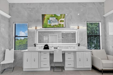 Designer ensuite bathroom in primary suite #1 - large vanity & smart TV