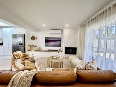Open plan lounge with Samsung Art TV and board games