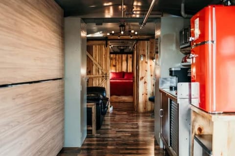 Sliding barn door separates bedroom from living area
