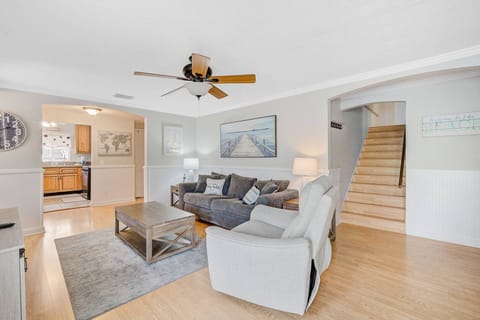 Stairs from the living space lead to a Kind Guest Room