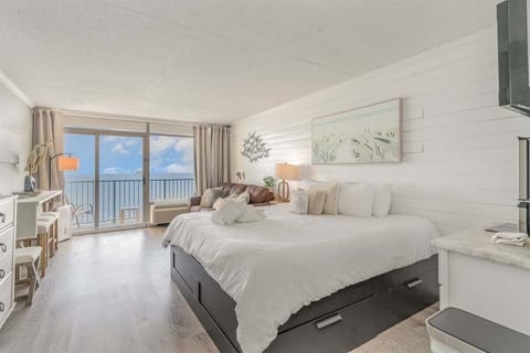Enjoy sweeping views of the Atlantic right from your king-sized bed in this gorgeous oceanfront condo.