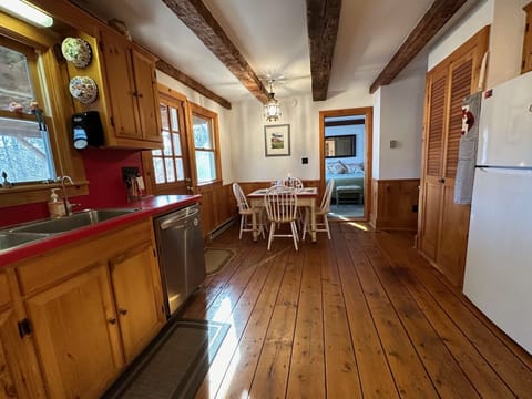 View of Kitchen and Bedroom from Living Room Dining table extends to seat 8