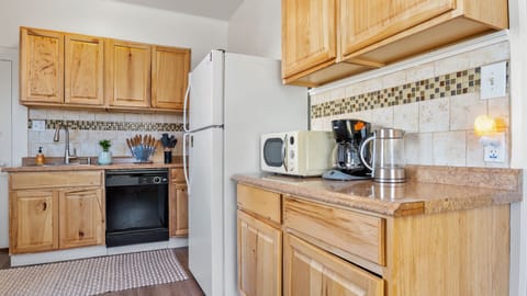 Plenty of Cupboards and Drawers, Coffee Maker, Microwave, and Water Pitcher