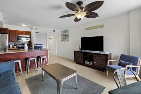 Gather for drinks as balcony views brighten the living space.