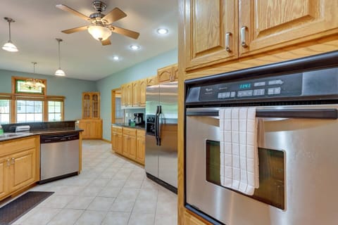 Large modern kitchen with bar seating, Whirlpool appliances and fully stocked.