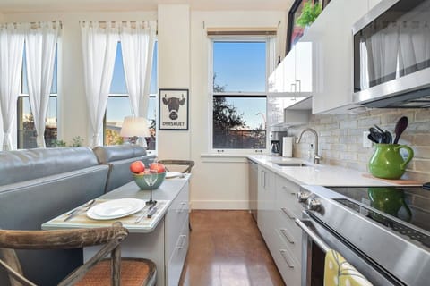 Fully equipped kitchen, with everything you need during your stay! Dining table seats 2 with storage.