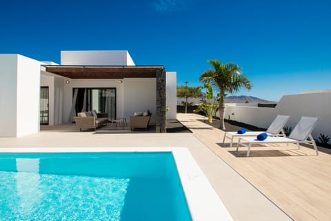 Impressive private pool surrounded by a sunny terrace.