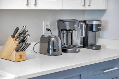 Well-stocked kitchen counter w/ coffee maker, toaster, and essentials ready for easy mornings.