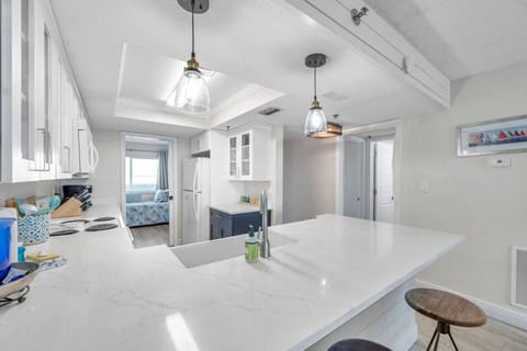 Bright, open kitchen w/ a large island and bar seating for casual meals and chats.