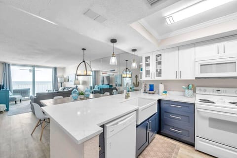 Spacious kitchen w/ large island, bar seating, and an open flow to the living space.