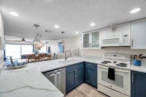 Fully equipped kitchen w/ ample counter space, perfect for cooking and gathering.