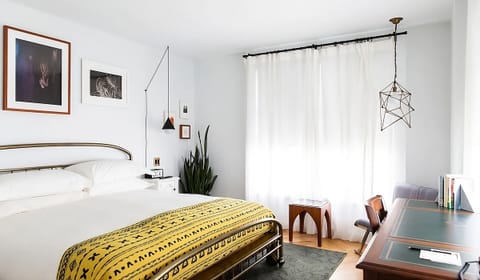 Lounge with morning light and art-filled walls for calm.