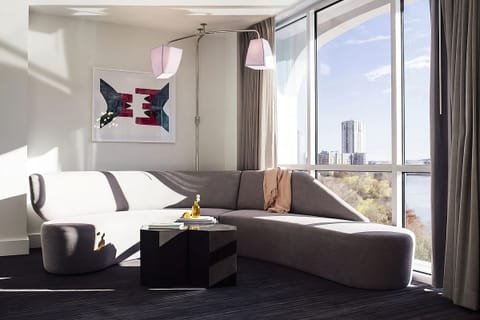 Unwind on the sculptural sofa with sweeping city views.