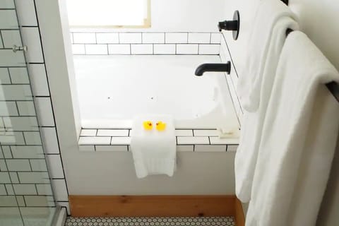 Soak in a bright tiled tub with spa-fresh towels.