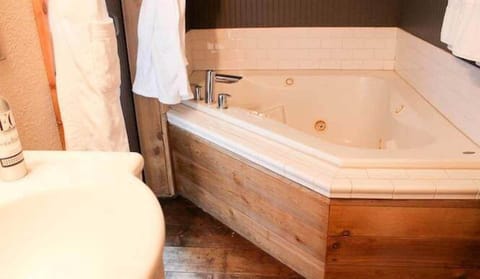 Soak away the day in a deep, corner spa tub.