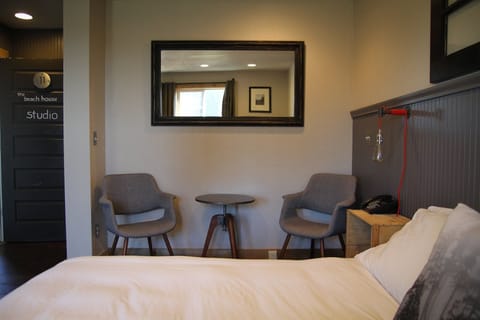 Unwind with morning coffee in cozy bedside lounge nook.