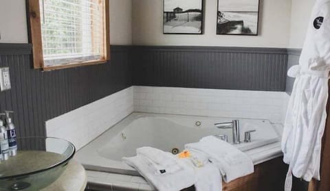 Indulge in a whirlpool soak with fluffy robes waiting.