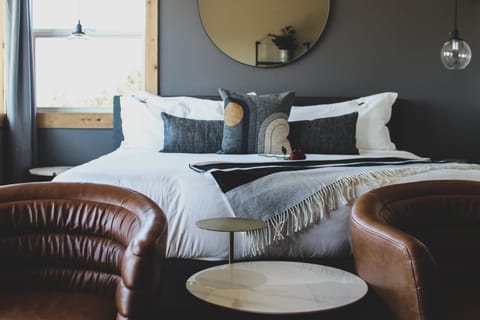 Sink into plush linens and unwind with cozy lounge seating