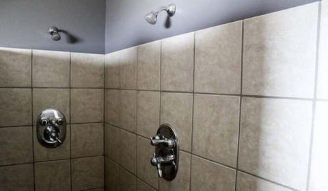 Rinse off in a clean, tiled shower with strong pressure