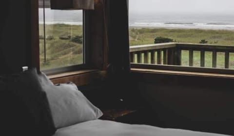 Gaze out at rolling waves from the comfort of bed
