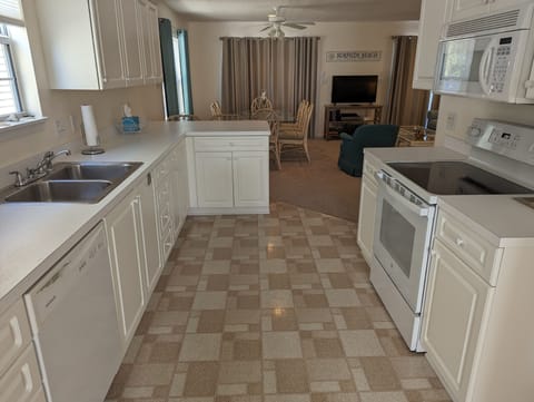 Kitchen opens to the dining room and living area.