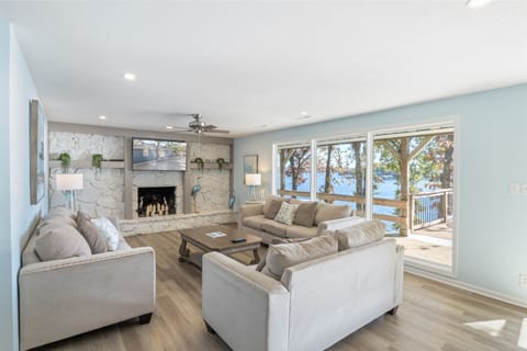 Plush sofas and warm ambiance with a scenic lake view