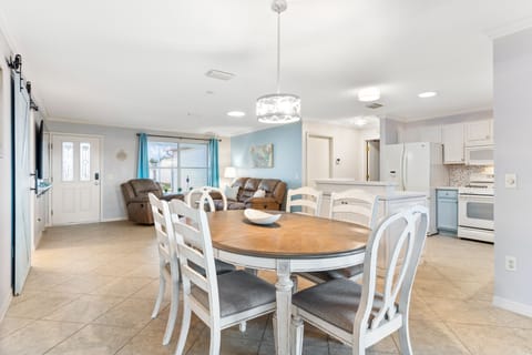 Dining room connects to kitchen and living spaces