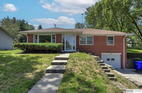 Brick home, exterior view, in culdesac.