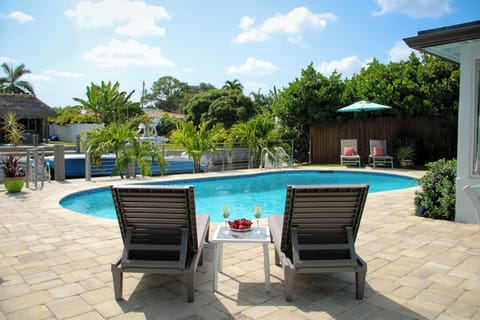 Relax in the lounge chairs overlooking the  pool and scenic canal.
