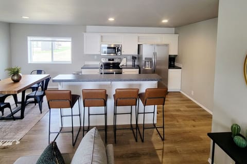 Kitchen island seating and a dining table, perfect for gatherings