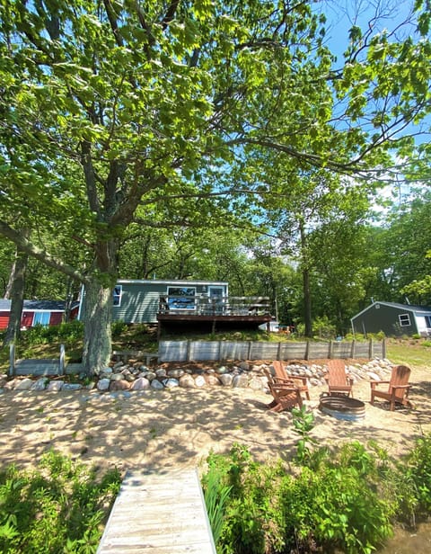 View from the lake. A private fire pit and beach.