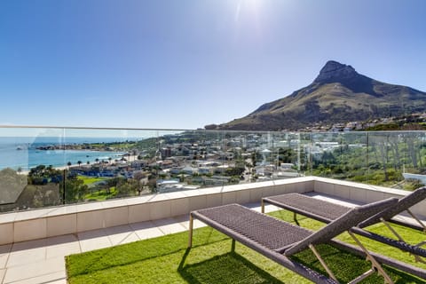 Panoramic View: Sweeping Ocean and mountain view from the top deck area