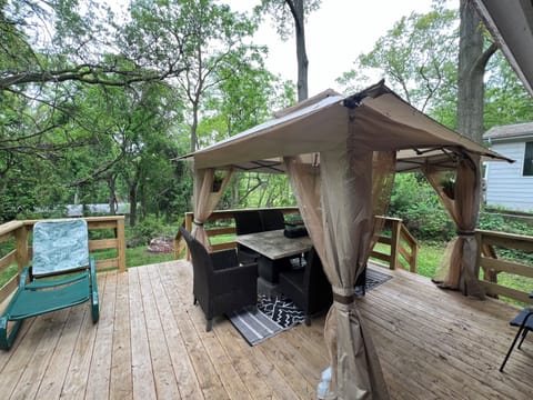 Newly built back porch with dinning table and canopy