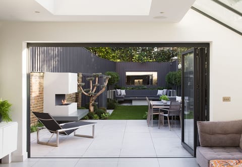 Private rear garden with bbq, pizza oven, firepit and fireplace.