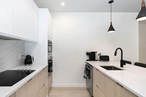 Wall oven, built in microwave, dishwasher and SMEGG appliances.