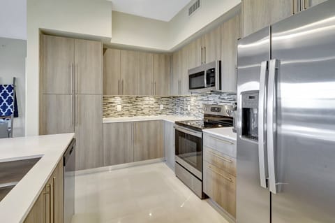 The kitchen is adorned with natural light and is fully equipped for seasonal rentals