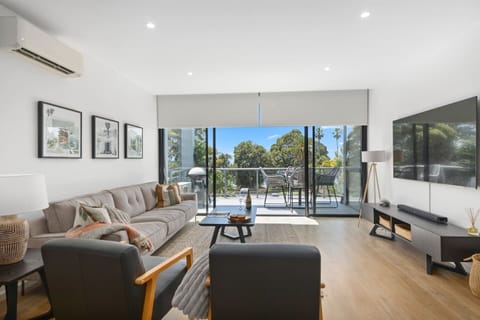 Seamless indoor-outdoor living allows you to enjoy views of Shellharbour North Beach, inviting the sea breezes to roll through the sliding glass doors.