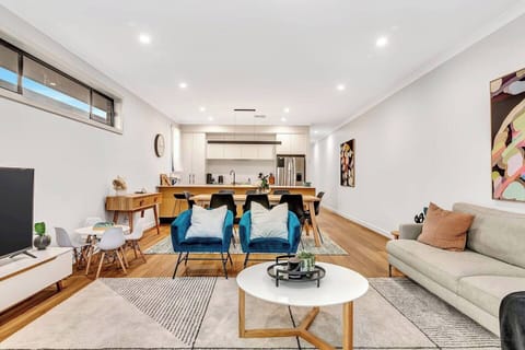 The open plan living and dining area downstairs creates plenty of space to spread out or come together around the central dining table.

