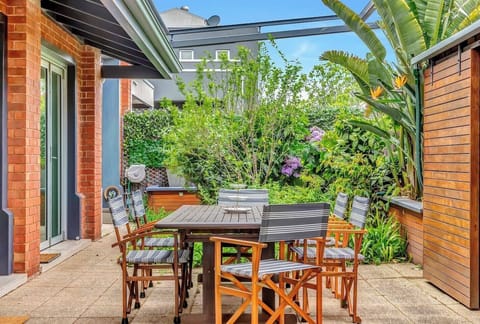 Immerse yourself in the verdant beauty of the private courtyard, offering a six-seater setting to enjoy meals alfresco.