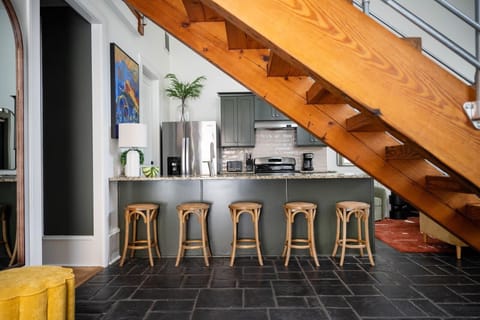 An additional dining area with five bar stools!