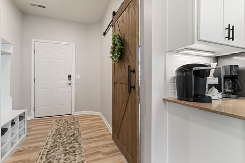 Entry room with barn door to office