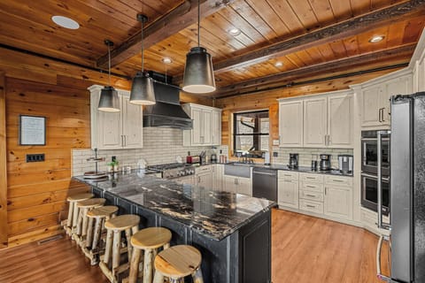 Kitchen with full size appliances and breakfast bar