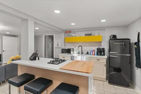 The kitchen area has all the cooking and dish essentials for a nice meal at home