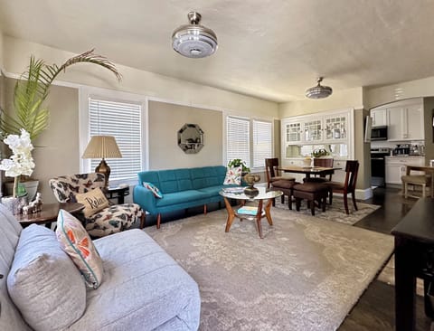 Living/diningHas 2 tw futons andelect fireplace 55” smart TV ceiling fans w Bluetooth sound